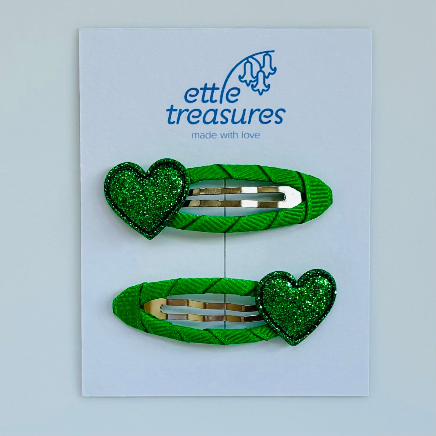 Green sparkle heart hair clips